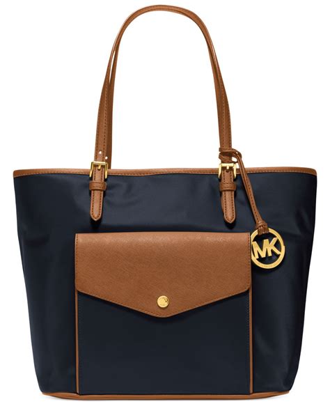 michael kors jet set nylon large pocket tote|Michael Kors bag with airplanes.